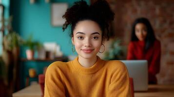 A smiling young woman likely an online tutor posing confidently in a comfortable and inviting workspace with a laptop surrounded by warm decor and a friendly atmosphere photo