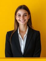Portrait of a young smiling and professional looking front desk manager in a formal business setting exuding confidence and approachability photo