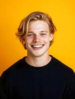 Portrait of a young smiling man on a colorful background photo
