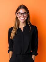 Smiling young professional woman in glasses posing for a portrait photo