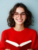 Smiling woman reading book as a writer photo