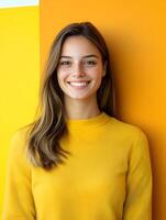 Smiling young woman in yellow sweater photo