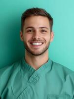 Portrait of a young smiling orderly on a color background photo