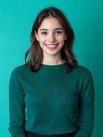 Young smiling woman in a green sweater photo