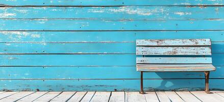 Weathered Blue Wooden Bench on Rustic Deck or Patio in Peaceful Outdoor Setting photo