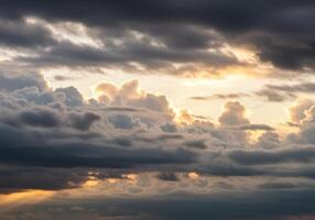 Dramatic sunset sky with layers of fluffy clouds creating a heavenly atmosphere. photo