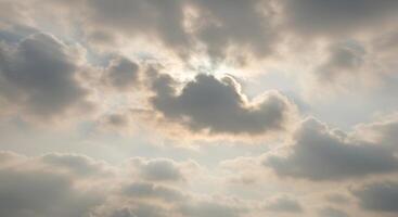 Sun rays filtering through the clouds create a serene and luminous skyscape. photo
