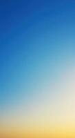 A calming gradient background merging serene blues with warm yellows, ideal for any design. photo