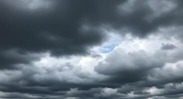 Storm clouds gather in a dramatic sky, creating a breathtaking cloudscape. photo