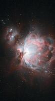 The breathtaking orion nebula displays a stunning array of colors and celestial formations. photo