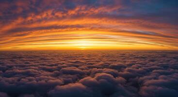 A breathtaking panorama showcases a colorful sunset over a sea of clouds, a stunning sight. photo
