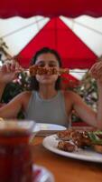 Savoring Flavorful Grilled Skewers While Relaxing in a Cozy and Inviting Outdoor Setting video