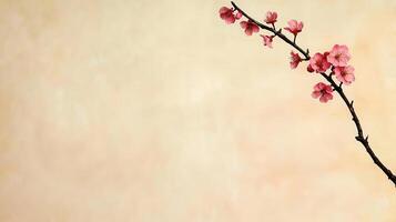 Delicate Pink Blossom Branch Against a Soft Beige Background Perfect for Spring Designs or Cards photo