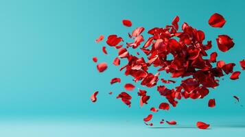 Red Rose Petals Falling on a Teal Background Romantic Floral Design for Valentines Day photo