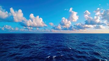 Serene Ocean Panorama Blue Water and Fluffy White Cloudscape on a Sunny Day photo