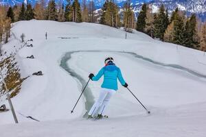 Skier on the snowy Austrian mountain slope photo