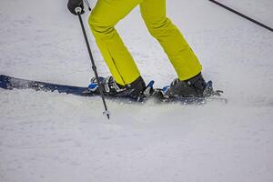 View of the skier in the action on the mountain slopes photo