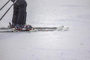 Detail from the skiing on the Alpine mountain slope photo
