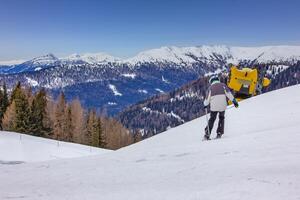 View of the skier on the mountain slope in Austria photo