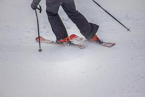 View of the skier in action on the mountain slopes photo