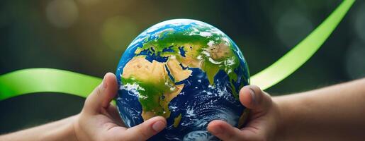 Hands holding a globe with a green ribbon symbolizing climate change awareness and action photo