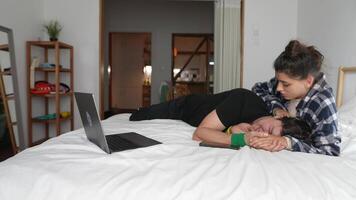 A Couple Enjoying Quality Time Together While Relaxing in a Cozy and Inviting Bedroom Space video