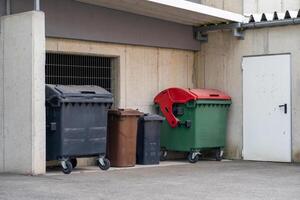 View of large and small plastic containers for various types of garbage photo