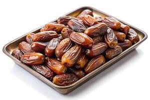 A neat arrangement of juicy dates placed in a tray, capturing their natural shine and texture, offering a healthy and flavorful snack on a white background photo