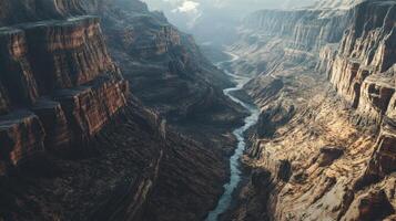 A river runs through a canyon with a rocky, barren landscape photo