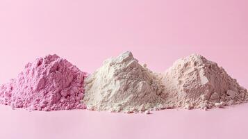 Three vibrant piles of cosmetic clay powder arranged neatly on soft pink background creating a visually appealing display within a creative skincare setting photo