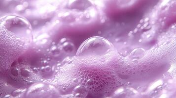 Vibrant purple foam creates a stunning background with bubbles generating a sense of depth and texture in a playful and colorful display photo