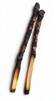 Close-up of two used, burnt matches placed on a plain white surface, symbolizing burnout, stress, or finality. photo