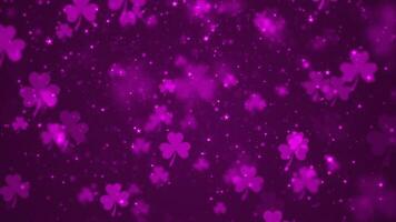 Lucky pink shamrocks, shiny stars and glowing glittering particles on a dark gradient background. This Saint Patrick's Day celebration party background animation is full HD and a seamless loop. video