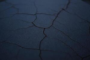 A close-up view reveals a textured surface with intricate cracks, forming an abstract design. photo