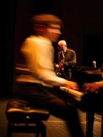 Jazz musicians perform on stage during a lively concert at an evening event photo