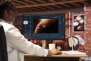 Woman in home office getting tasks done with AI program turning text prompt into videos. Close up of person using computer to make use of text to artificial intelligence generative models photo