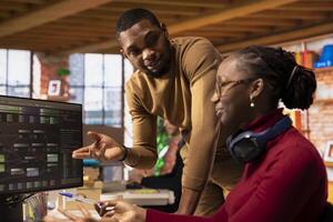 Team of technicians brainstorming in startup office, coding advanced AI algorithm and machine learning models. African american colleagues talk in artificial intelligence Silicon Valley workplace photo