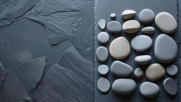A group of pebbles arranged on a stone surface photo