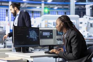 Photovoltaics factory developer programming AI tools, developing solutions to automate fault detection. Specialist using machine learning to analyze data and predict potential equipment failures photo