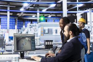 Team of photovoltaics factory technicians working together to improve solar panels efficiency. Teamworking solar panels manufacturing plant specialists researching cheaper solar solutions photo