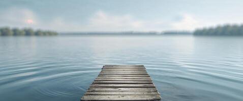 A wooden dock is in the middle of a lake photo