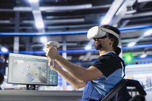 Photovoltaics factory technician using VR tech to analyze and modify assembly line configurations. Solar panels plant staff member uses virtual reality equipment to do system performance optimizations photo