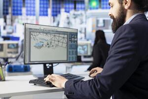 Photovoltaics facility employee reviewing efficiency reports on computer, interpreting trends to improve production output. Close up of solar panels plant expert identifying potential system failures photo