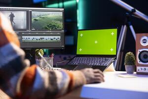 maker editing montage clips on coloring software next to mockup, working on color correction and motion graphics to edit footage. Content creator editing clips on toolbar panels. photo