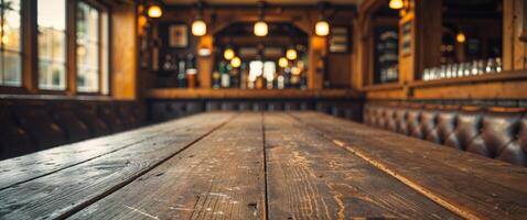 A wooden table in a pub with a bar photo