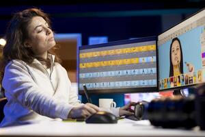Photographer using photo editing software on PC display in multimedia creative studio, making adjustment on graphic tablet. Freelancer using retouching program on touchscreen device