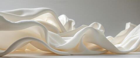 A white sculpture with a wave pattern on it photo