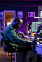 Musical composer recording his acoustic guitar notes in home studio, creating an amazing track by singing lyrics on microphone. Singer producer uses mixing console and digital software. photo