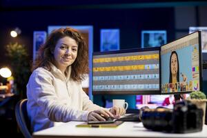 Portrait of happy photo editor browsing through images to determine the most appropriate visuals for publication in magazines. Smiling photographer manipulating images in creative studio