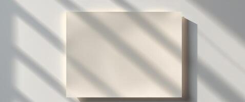 A white wall with a square piece of paper on it photo